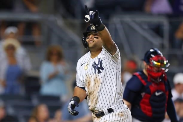 Rougned Odor of the New York Yankees gestures after he hit a home run against the Boston Red Sox during the seventh inning of a game at Yankee...