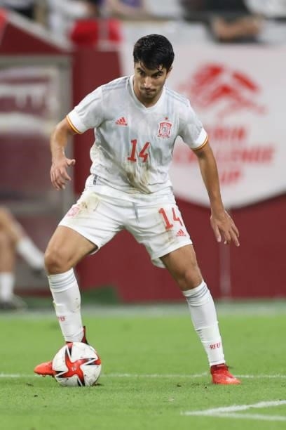 Carlos Soler of Spain in action during the U-24 international friendly match between Japan and Spain at the Noevir Stadium Kobe on July 17, 2021 in...