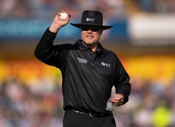 Umpire Martin Saggers prepares to clean the ball during the 2nd T20I between England and Pakistan at Emerald Headingley Stadium on July 18, 2021 in...