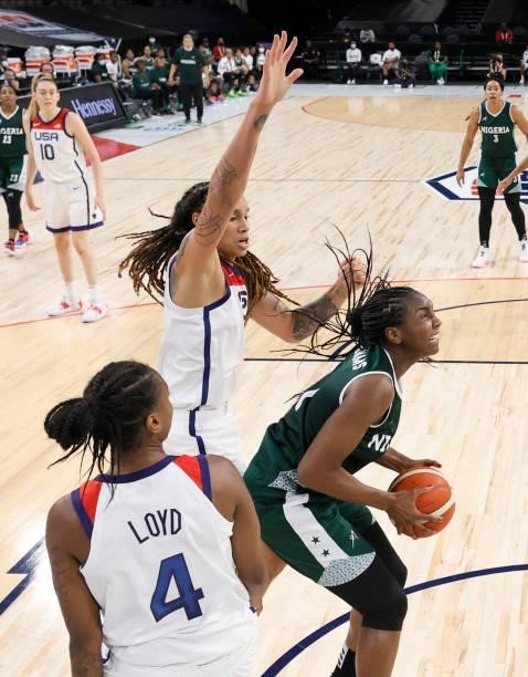 Elizabeth Williams of Nigeria is defended by Jewell Loyd and Brittney Griner of the United States during an exhibition game at Michelob ULTRA Arena...