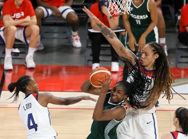 Elizabeth Williams of Nigeria is defended by Jewell Loyd and Brittney Griner of the United States during an exhibition game at Michelob ULTRA Arena...