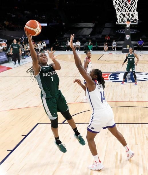 Elizabeth Williams of Nigeria shoots against Tina Charles of the United States during an exhibition game at Michelob ULTRA Arena ahead of the Tokyo...