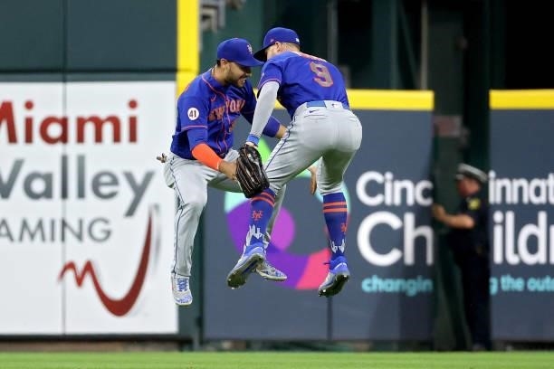 Michael Conforto and Brandon Nimmo of the New York Mets celebrate after beating the Cincinnati Reds 15-11 in eleven innings at Great American Ball...