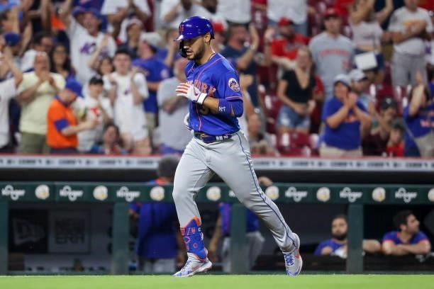 Michael Conforto of the New York Mets rounds the bases after hitting a home run in the eleventh inning against the Cincinnati Reds at Great American...