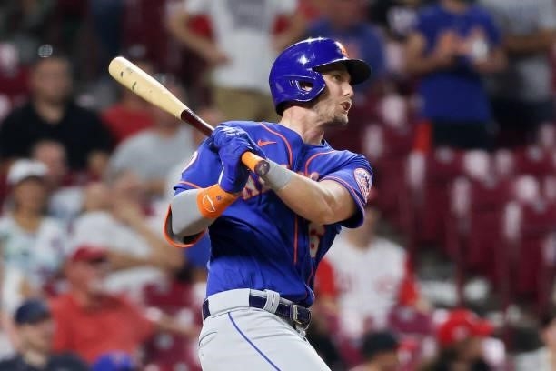 Jeff McNeil of the New York Mets hits a single in the eleventh inning against the Cincinnati Reds at Great American Ball Park on July 19, 2021 in...