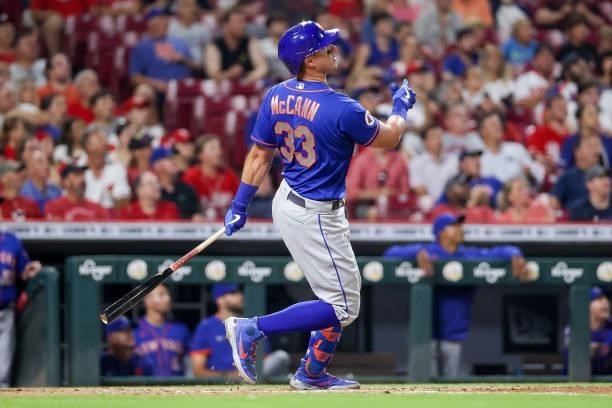 James McCann of the New York Mets hits a home run in the eighth inning against the Cincinnati Reds at Great American Ball Park on July 19, 2021 in...