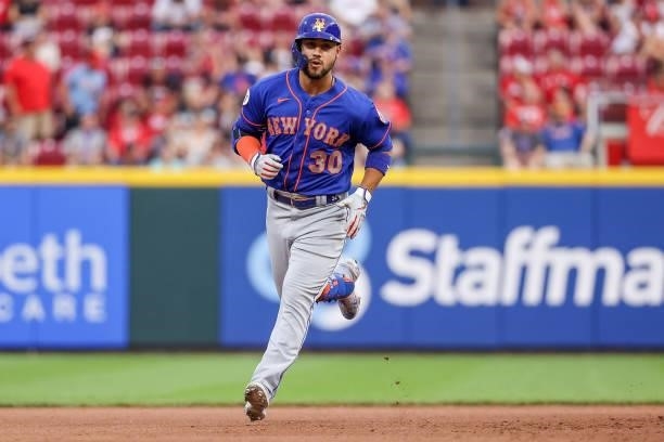 Michael Conforto of the New York Mets rounds the bases after hitting a home run in the fourth inning against the Cincinnati Reds at Great American...