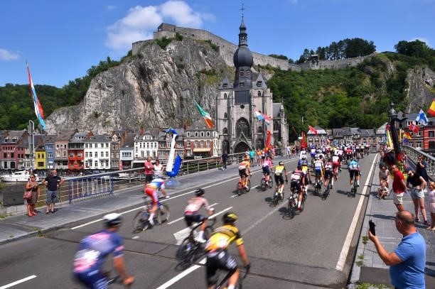 The Peloton passing through a bridge in front of The Collegiate Church of Our Lady at Dinant City during the 42nd Tour de Wallonie 2021, Stage 1 a...