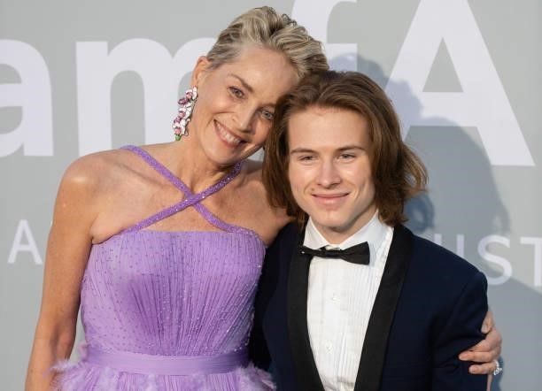 Sharon Stone and Roan Joseph Bronstein Stone attend the amfAR Cannes Gala 2021 during the 74th Annual Cannes Film Festival at Villa Eilenroc on July...
