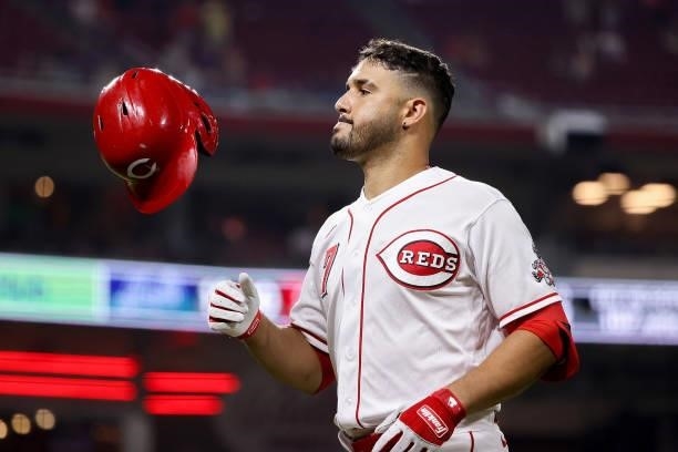 Eugenio Suarez of the Cincinnati Reds walks across the field in the tenth inning against the New York Mets at Great American Ball Park on July 19,...