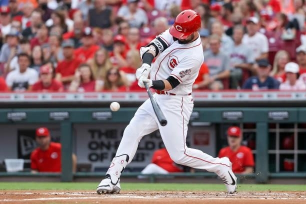 Jesse Winker of the Cincinnati Reds hits a single in the first inning against the New York Mets at Great American Ball Park on July 19, 2021 in...