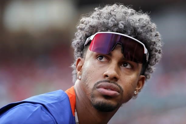 Francisco Lindor of the New York Mets looks on from the dugout in the first inning against the Cincinnati Reds at Great American Ball Park on July...