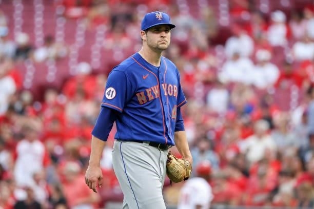 Jerad Eickhoff of the New York Mets walks across the field in the first inning against the Cincinnati Reds at Great American Ball Park on July 19,...