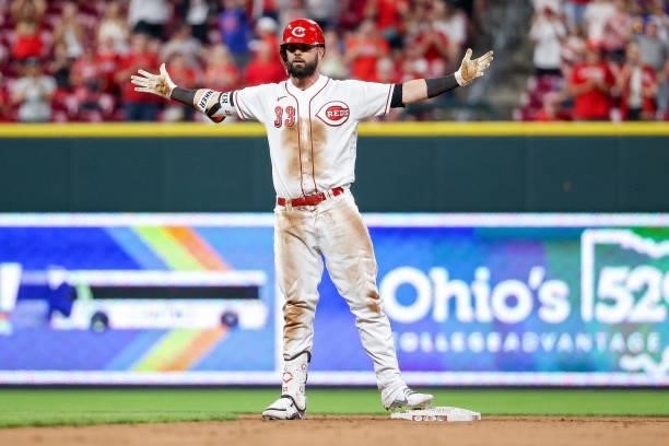 Jesse Winker of the Cincinnati Reds celebrates after hitting a double in the ninth inning against the New York Mets at Great American Ball Park on...