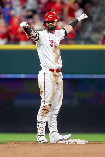 Jesse Winker of the Cincinnati Reds celebrates after hitting a double in the ninth inning against the New York Mets at Great American Ball Park on...