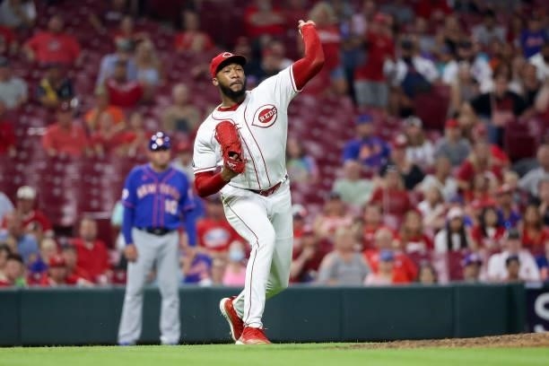 Amir Garrett of the Cincinnati Reds throws to first base in the seventh inning against the New York Mets at Great American Ball Park on July 19, 2021...