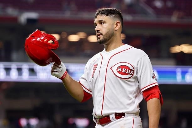 Eugenio Suarez of the Cincinnati Reds walks across the field in the tenth inning against the New York Mets at Great American Ball Park on July 19,...