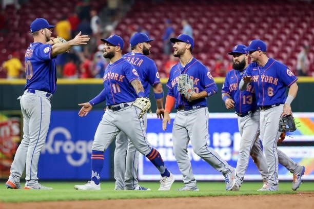 The New York Mets celebrate after beating the Cincinnati Reds 15-11 in eleven innings at Great American Ball Park on July 19, 2021 in Cincinnati,...