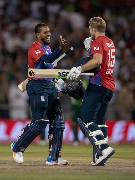 Chris Jordan of England celebrates scoring the winning runs with team mate David Willey during the 3rd T20I between England and Pakistan at Emirates...