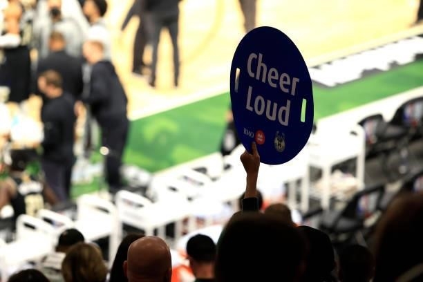 Milwaukee Bucks fan holds a "cheer louder