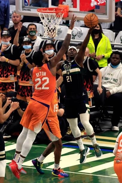 Jrue Holiday of the Milwaukee Bucks goes up for a shot against Deandre Ayton of the Phoenix Suns during the first half in Game Six of the NBA Finals...