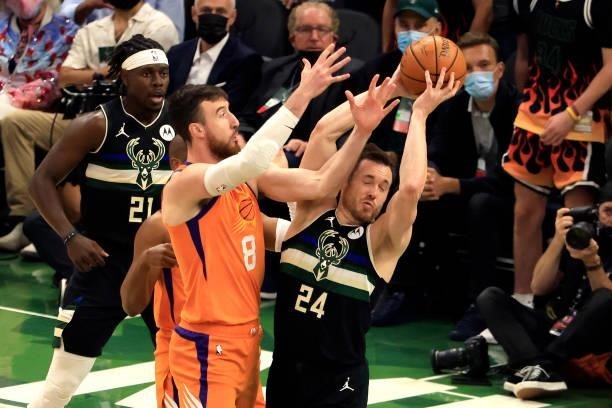 Pat Connaughton of the Milwaukee Bucks is pressured by Frank Kaminsky of the Phoenix Suns during the first half in Game Six of the NBA Finals at...