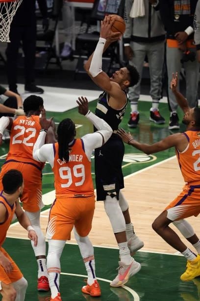 Giannis Antetokounmpo of the Milwaukee Bucks shoots against Jae Crowder of the Phoenix Suns during the first half in Game Six of the NBA Finals at...