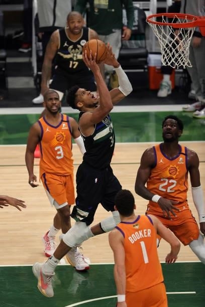Giannis Antetokounmpo of the Milwaukee Bucks goes up for a shot against the Phoenix Suns during the second half in Game Six of the NBA Finals at...