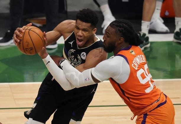 Giannis Antetokounmpo of the Milwaukee Bucks drives to the basket against Jae Crowder of the Phoenix Suns during the second half in Game Six of the...