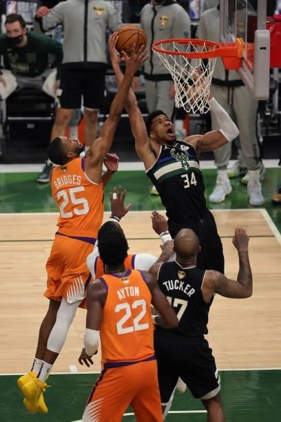 Giannis Antetokounmpo of the Milwaukee Bucks goes up for a shot against Mikal Bridges of the Phoenix Suns during the second half in Game Six of the...