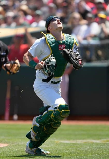 Sean Murphy of the Oakland Athletics chases after a foul pop-up off the bat of Luis Rengifo of the Los Angeles Angels in the top of the fourth inning...