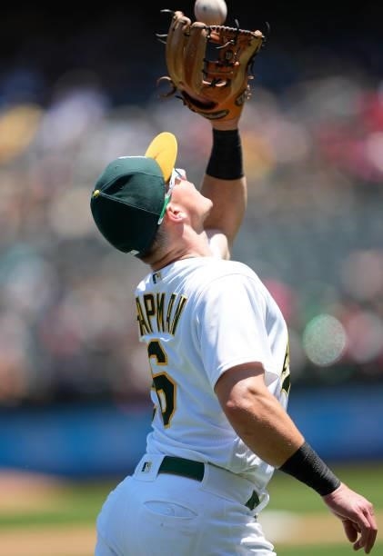 Matt Chapman of the Oakland Athletics catches a pop-up on the infield off the bat of Luis Rengifo of the Los Angeles Angels in the top of the fourth...