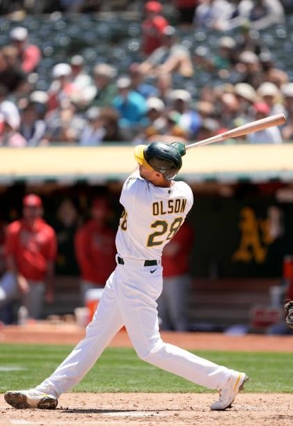 Matt Olson of the Oakland Athletics hits a solo home run against the Los Angeles Angels in the bottom of the fourth inning at RingCentral Coliseum on...