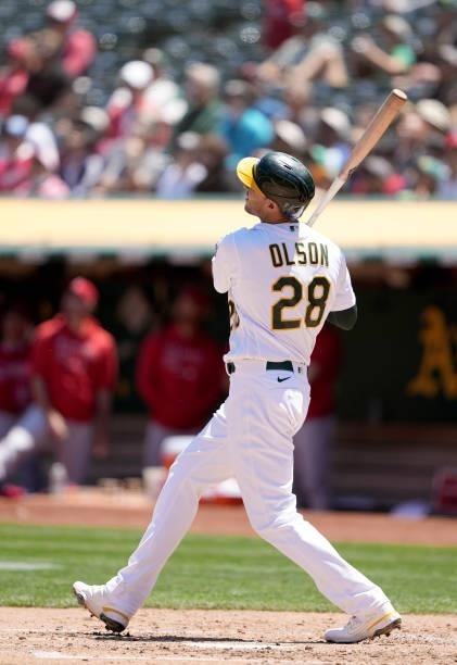 Matt Olson of the Oakland Athletics hits a solo home run against the Los Angeles Angels in the bottom of the fourth inning at RingCentral Coliseum on...