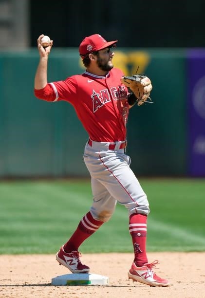 David Fletcher of the Los Angeles Angels gets the put out at second and looks to throw to first base against the Oakland Athletics in the bottom of...