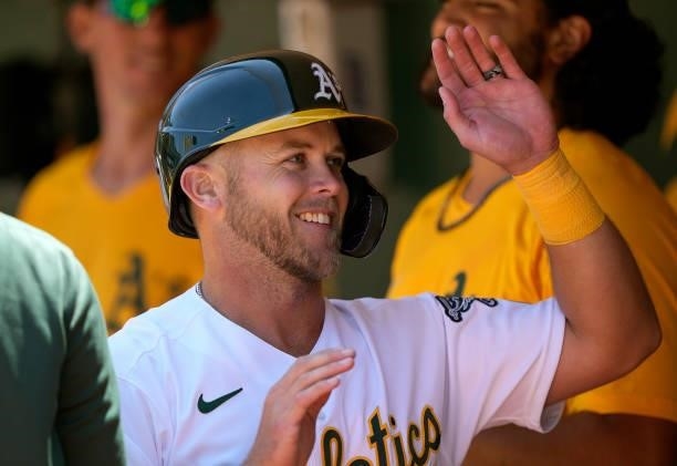 Jacob Wilson of the Oakland Athletics is congratulated by teammates after he got his firs career Major League hit against the Los Angeles Angels in...