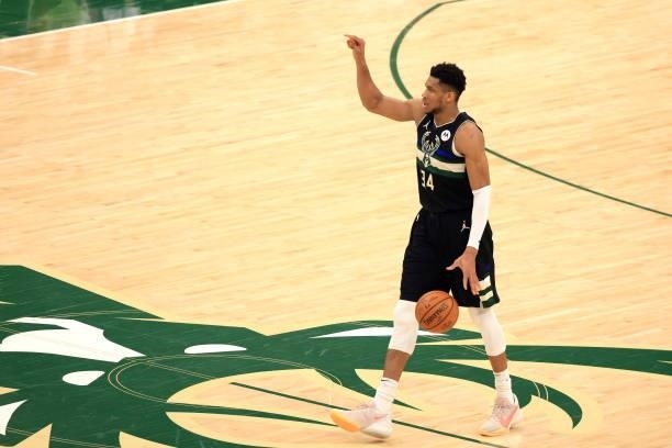 Giannis Antetokounmpo of the Milwaukee Bucks brings the ball up court against the Phoenix Suns during the second half in Game Six of the NBA Finals...