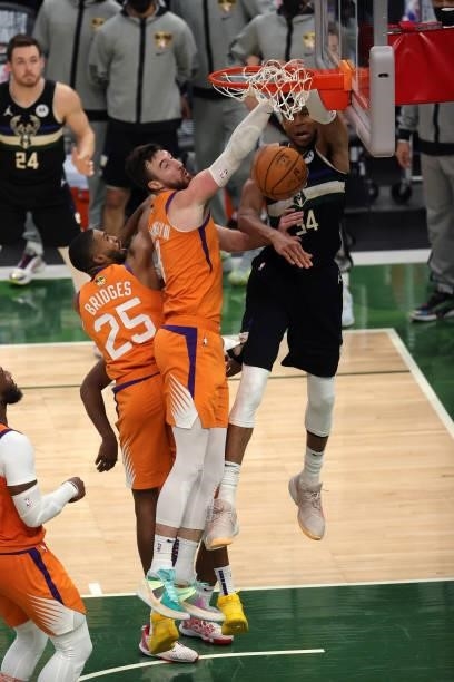 Giannis Antetokounmpo of the Milwaukee Bucks dunks against Frank Kaminsky of the Phoenix Suns during the second half in Game Six of the NBA Finals at...