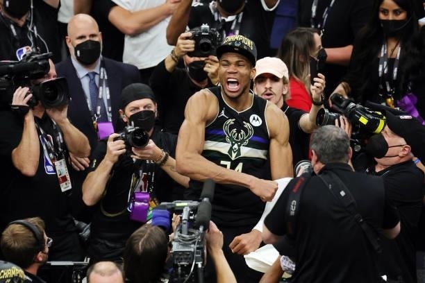 Giannis Antetokounmpo of the Milwaukee Bucks celebrates defeating the Phoenix Suns in Game Six to win the 2021 NBA Finals at Fiserv Forum on July 20,...