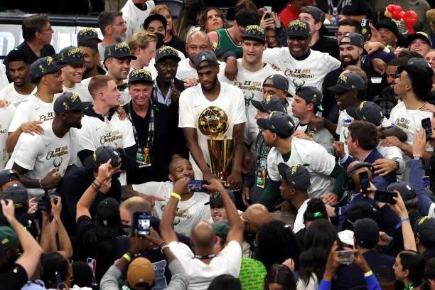Members of the Milwaukee Bucks celebrate after defeating the Phoenix Suns in Game Six to win the 2021 NBA Finals at Fiserv Forum on July 20, 2021 in...