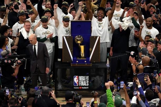 Members of the Milwaukee Bucks celebrate after defeating the Phoenix Suns in Game Six to win the 2021 NBA Finals at Fiserv Forum on July 20, 2021 in...