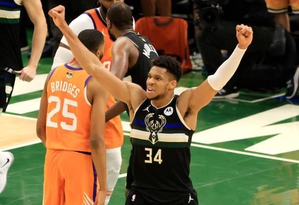 Giannis Antetokounmpo of the Milwaukee Bucks celebrates in the final second before defeating the Phoenix Suns in Game Six to win the 2021 NBA Finals...