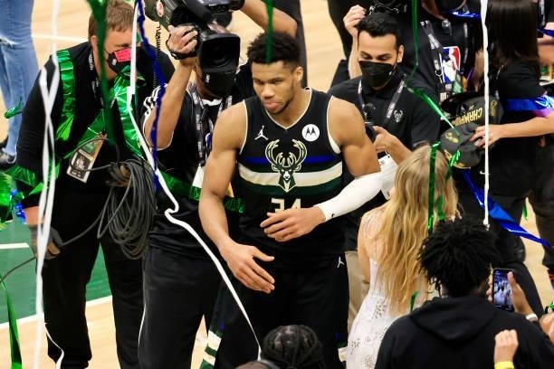 Giannis Antetokounmpo of the Milwaukee Bucks celebrates defeating the Phoenix Suns in Game Six to win the 2021 NBA Finals at Fiserv Forum on July 20,...