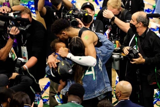 Giannis Antetokounmpo of the Milwaukee Bucks celebrates with his family after defeating the Phoenix Suns in Game Six to win the 2021 NBA Finals at...