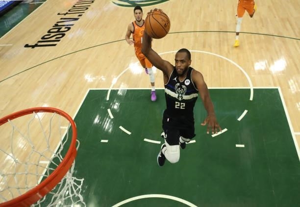 Khris Middleton of the Milwaukee Bucks goes up for a slam dunk against the Phoenix Suns during the second half in Game Six of the NBA Finals at...