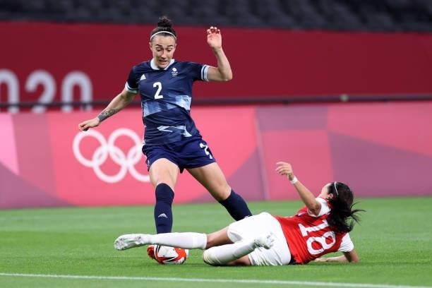 Lucy Bronze of Team Great Britain is challenged by Camila Saez of Team Chile during the Women's First Round Group E match between Great Britain and...