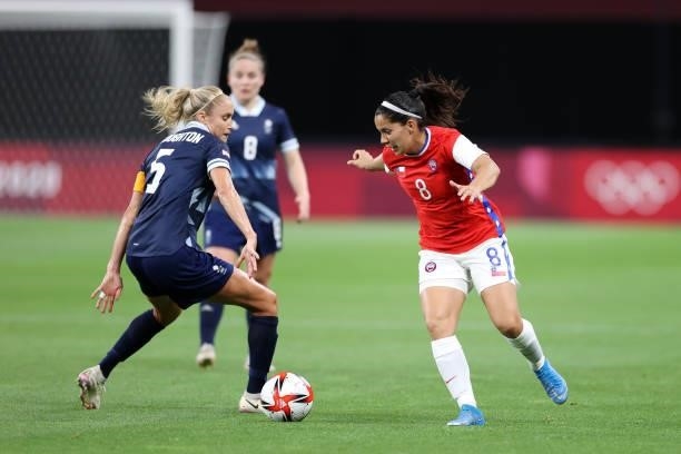 Karen Araya of Team Chile battles for possession with Steph Houghton of Team Great Britain during the Women's First Round Group E match between Great...