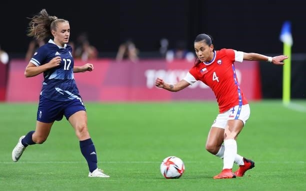Francisca Lara of Team Chile passes the ball whilst under pressure from Georgia Stanway of Team Great Britain during the Women's First Round Group E...