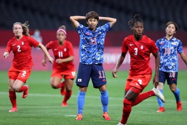 Mina Tanaka of Team Japan reacts after having a penalty saved by Stephanie Labbe of Team Canada during the Women's First Round Group E match between...