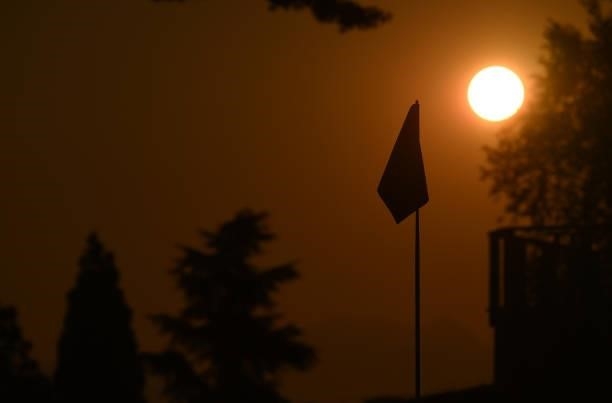 Flag is seen at sunrise during the Pro-Am prior to the start of the The Amundi Evian Championship at Evian Resort Golf Club on July 21, 2021 in...